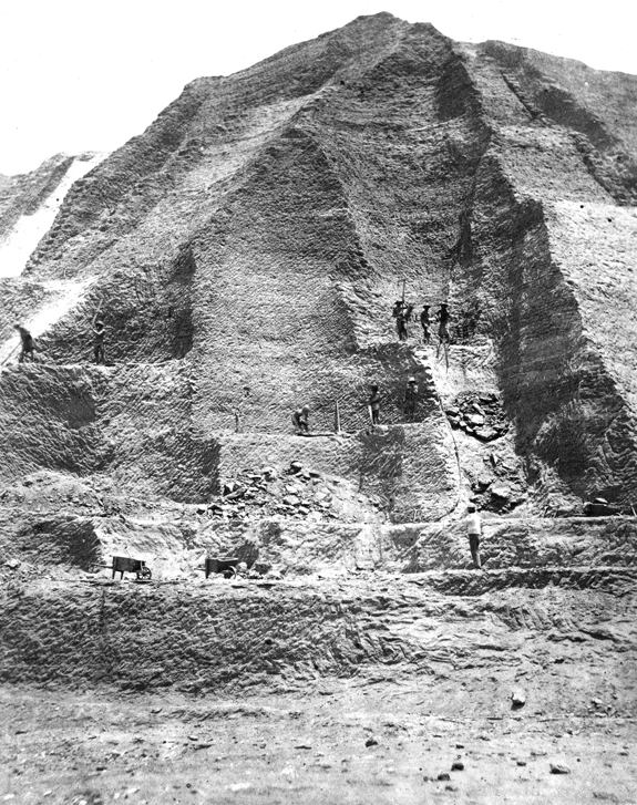 Workers in the 1860s excavate a "mountain" of guano