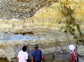 Geologists examine rock outcrops in northern Peru.