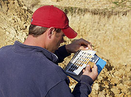 Man matching sample to Munsell Color Book